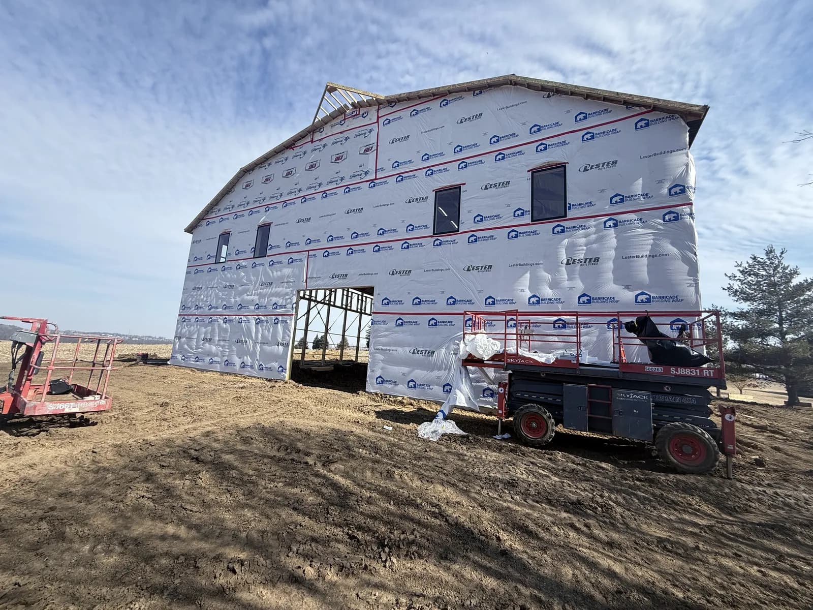 Post-frame building wrapped and ready for siding by ORC in Iowa City